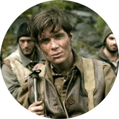 An image of Cillian Murphy, covered in dirt, looking into the camera and wearing an early 1900s soldier's uniform