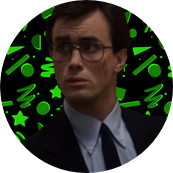 An image of Herbert West (Reanimator 1985) in front of a green 80s print background